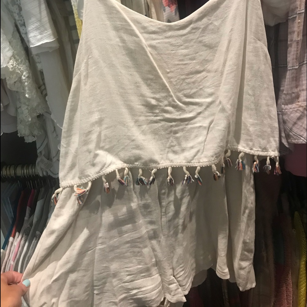 Cream linen romper with colorful tassels